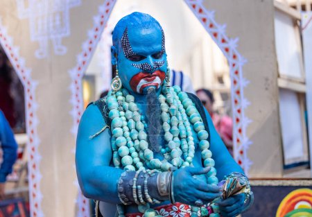 Photo for Faridabad, Haryana, India - February 17 2024: Portrait of an young male artist with painted face to play the character of jinn of aladdin series to entertain tourists. - Royalty Free Image