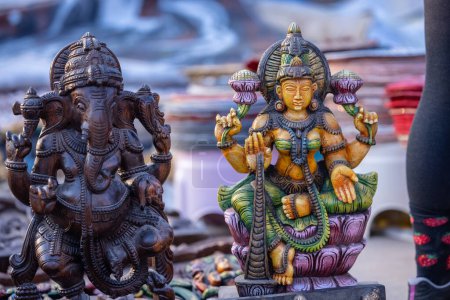 Photo for A handmade wooden idol of Lord Ganesh and goddess Laxmi sounds like a beautiful tribute to the deity's revered presence in Hindu mythology and culture. - Royalty Free Image