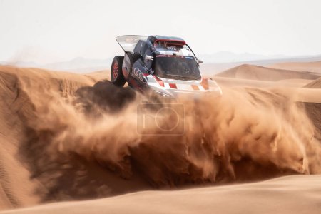 Photo for Yanbu, Saudi Arabia. 05-19 Jenuary 2024. 46 Rally Dakar. #202, Stephane Peterhansel  Edouard Boulanger, Audi RS Q e-tron, Team Audi Sport, in the dunes. - Royalty Free Image