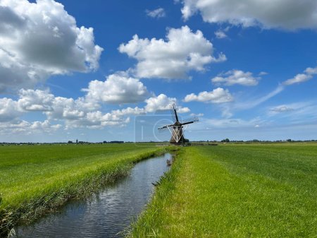 Photo for A smock mill in Rinsumageast, Friesland, Netherlands - Royalty Free Image