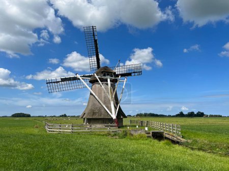 Photo for A smock mill in Rinsumageast, Friesland, Netherlands - Royalty Free Image
