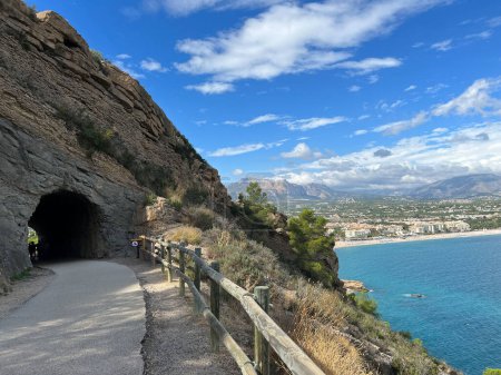 Photo for Tunnel through a rock at Parque Natural Serra Gelada around Albir in Spain - Royalty Free Image