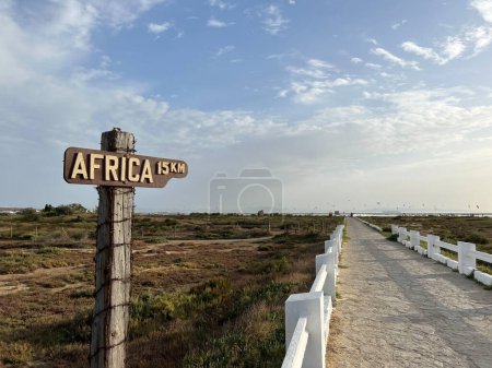 Sign Africa 15 km at Los Lances beach around Tarifa, Spain