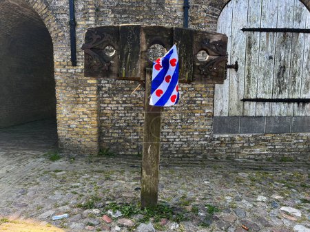 Photo for Scaffold with Frisian flag in Sloten, Friesland the Netherlands - Royalty Free Image