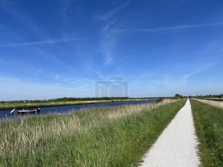 Photo for Bicycle path around Nationaal park De Alde Feanen in Friesland the Netherlands - Royalty Free Image