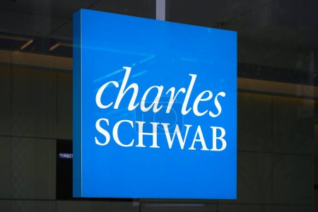 Photo for New York, NY - April 26, 2023 - Charles Schwab Corporation financial services company logo sign in window of Midtown Manhattan office - Royalty Free Image
