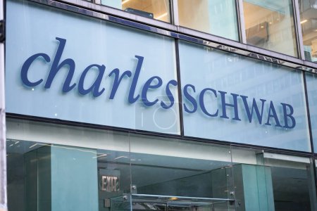 Photo for New York, NY - April 26, 2023 - Charles Schwab Corporation financial services company logo sign in window of Midtown Manhattan branch office - Royalty Free Image