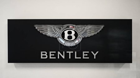 Photo for Honolulu, Hawaii - Jan. 12, 2024: Bentley Motors wall insignia on luxury auto dealer office wall. - Royalty Free Image