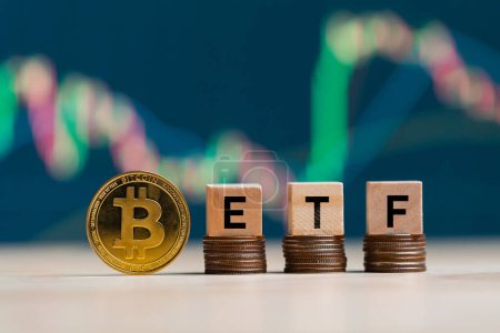 Photo for Bitcoin gold coin words ETF wooden blocks on rows stack coins and defocused chart background, cryptocurrency bitcoin halving concept. The bitcoin ETF which refers to Exchange Traded Fund. - Royalty Free Image