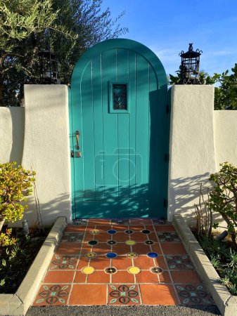 Photo for A catalina mexican tile green garden gate door retro sun entrance saltillo tiles - Royalty Free Image