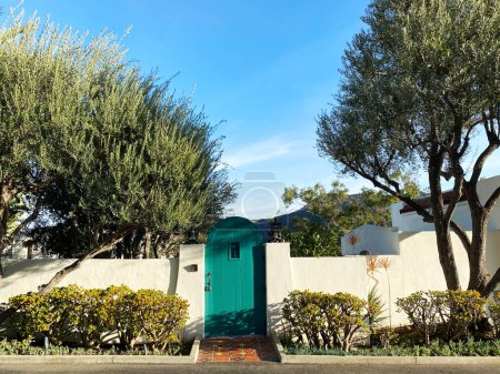 Photo for A gate door catalina mexican saltillo tiles tile green garden retro sunny wall - Royalty Free Image