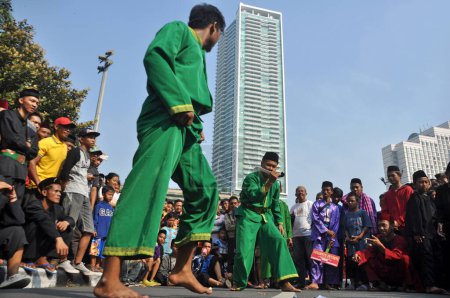 Photo for Jakarta, Indonesia, June 14, 2015. Betawi pencak silat martial arts performance at the Car Free Day event, Jakarta Indonesia - Royalty Free Image