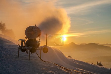 Photo for Snow cannon during snowmaking on the slope - Royalty Free Image