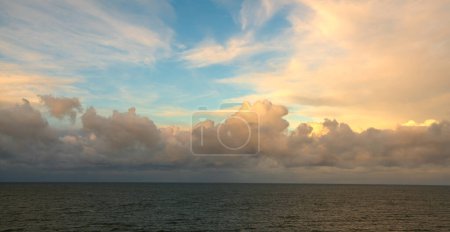 Téléchargez les photos : Panorama of storm clouds over the sea during sunset - en image libre de droit