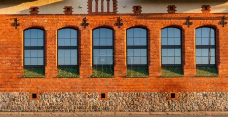Photo for Facade of historic port warehouse building undergoing renovation - Royalty Free Image