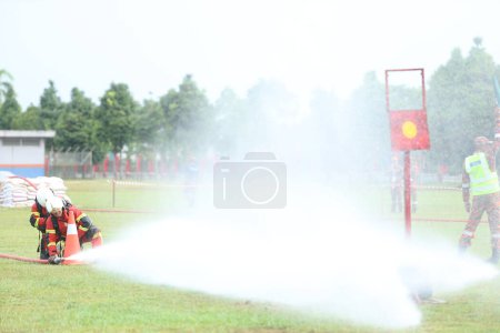 Photo for Terengganu September 14, 2023. The Competence Skills Competition for firefighters was held in Terengganu.  Terengganu September 14, 2023. The Competence Skills Competition for firefighters was held in Terengganu. - Royalty Free Image