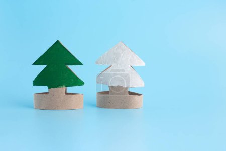 Photo for How to make a Christmas tree out of toilet paper rolls, process art, miniature spruce trees, toy package, recycled or waste paper craft concept for kid and kindergarten, DIY, tutorial - Royalty Free Image