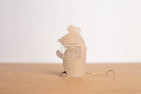 Photo for DIY ideas for paper craft for kids, process of making mouse from empty recycled toilet paper roll, a piece of cardboard sitting on top of a table, cute single animal, close-up photo - Royalty Free Image