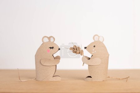 Photo for Couple of mice made out of recycled toilet paper roll, conceptual art, tiny rats, cereal box, brown paper, simple primitive tube shape toy, educational and craft activity, - Royalty Free Image
