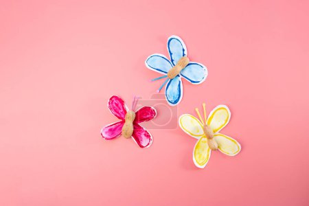 part of process making paper craft butterflies, stamp, paint tubes, recycling concept, easy craft for kids, DIY, tutorial