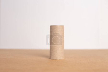 Photo for Empty recycled toilet paper roll sitting on top of a table, close-up photo, front view, material for paper craft for kids, - Royalty Free Image