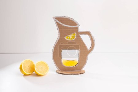 Captured in this photo is a cardboard pitcher for lemonade, handmade with care. This amazing summer craft for kids is not only enjoyable to create but also teaches to appreciate effort and creativity