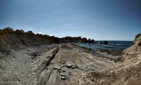 Broken coast at Liencres Cantabria , on a sunny summer day, low tide. Empty beach, low tide, clear sky, aerial view