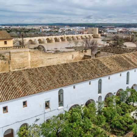 Photo for Aerial view of the city of Cordoba, Spain, from the Alcazar de los Reyes Cristianos, with the roman bridge over the Guadalquivir river in the background - Royalty Free Image