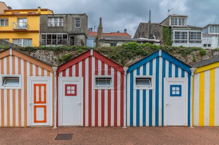 Colorful small houses used as public toilets on the seafront of the town of Ortigueira, province of A Coruna, Galicia, northwestern Spain