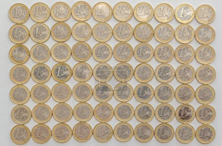 Several one euro coins on white background