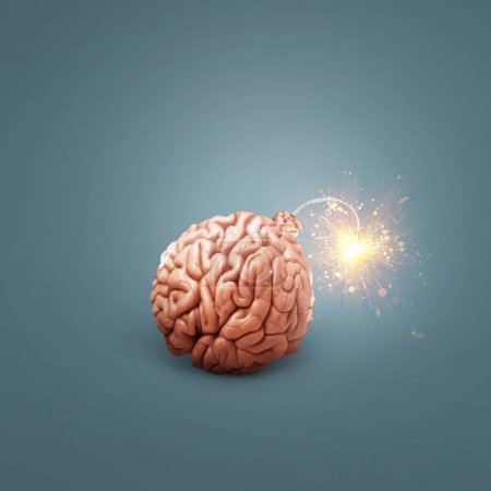 Creative brain bomb with a wick and sparks is lit on a dark blue background. Genius and idea, concept idea. Headache and stress. Science and education