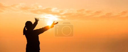 Photo for Silhouette of woman hand praying spirituality and religion, female worship to god. banner with copy space. Religious people are humble to God. Christians have hope faith and faith in god. - Royalty Free Image
