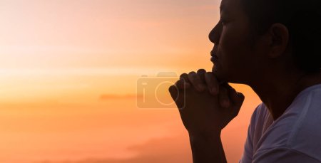 Photo for Silhouette of woman hand praying spirituality and religion, female worship to god. Christianity religion concept. Religious people are humble to God. Christians have hope faith and faith in god. - Royalty Free Image