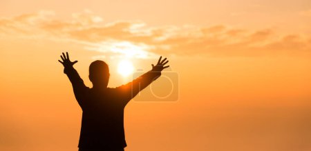 Photo for Silhouette of woman raising her hand praying spirituality and religion, banner and copy space of female worship to god. Christianity religion concept.Christians person are pray humility humble to god. - Royalty Free Image