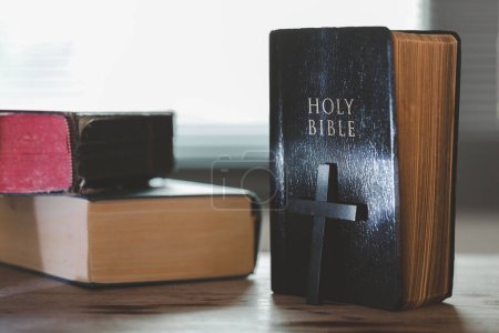 Photo for Holy bible book for education on wooden table with background. Christian catholic with protestant worship and pray in church. Concept of learning about faith god and religion, jesus spiritual. - Royalty Free Image