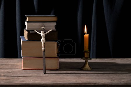 Photo for Still Life with Vintage Book and Wooden Cross: Capturing the Essence of Religious Traditions. Antique Bible and Old Book on Rustic Wooden Table: Exploring Heritage and Knowledge. - Royalty Free Image