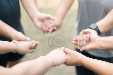 Photo for Diverse group came together to pray, support, and help each other, showcasing the strength of community through their diverse backgrounds and unified hands. Group Christian pray concept. - Royalty Free Image