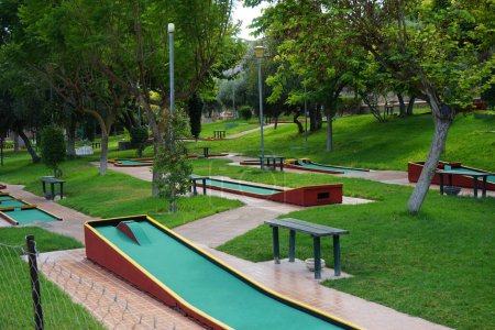 Photo for Miniature golf in Lardos. Miniature golf, minigolf, putt-putt, crazy golf, and by several other names is an offshoot of the sport of golf focusing solely on the putting aspect of its parent game. Lardos, Rhodes Island, South Aegean region, Greece - Royalty Free Image