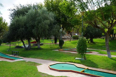Miniature golf in Lardos. Miniature golf, minigolf, putt-putt, crazy golf, and by several other names is an offshoot of the sport of golf focusing solely on the putting aspect of its parent game. Lardos, Rhodes Island, South Aegean region, Greece