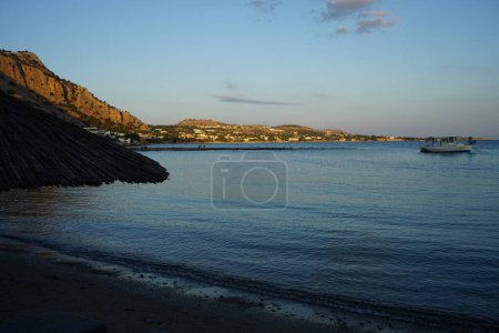 Beach on the Mediterranean coast in Pefki. Pefkos or Pefki is a well-known beach resort located on the eastern coast of Rhodes Island, Greece 