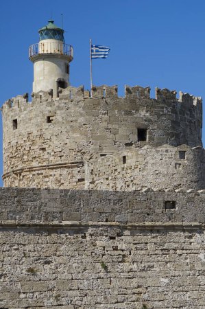 View of the Fortress of Agios Nikolaos in August. The Fortress of Agios Nikolaos or Fort of Saint Nicholas is a single stronghold that occupies the northern tip of the homonymous pier. Rhodes city, Rhodes island, Greece