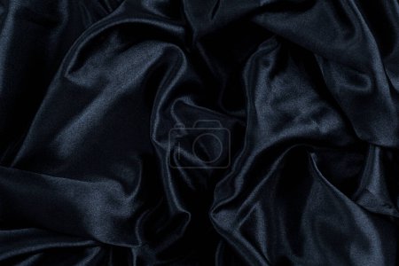 Foto de Fondo abstracto tejido negro, pliegues ondulados. Textura de fondo - Imagen libre de derechos