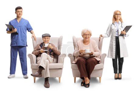 Photo for Female doctor and male nurse looking after an elderly man and woman sitting in armchairs isolated on white background - Royalty Free Image