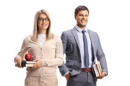 Photo for Smiling male and female teacher holding books isolated on white background - Royalty Free Image