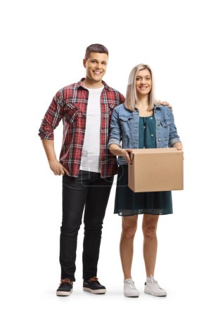 Photo for Young couple standing with a cardboard box isolated on white background - Royalty Free Image