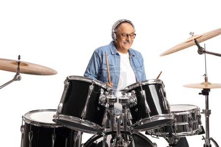 Photo for Mature man with headphones playing drums isolated on white background - Royalty Free Image