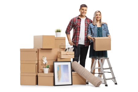 Photo for Young couple posing with removal boxes isolated on white background - Royalty Free Image
