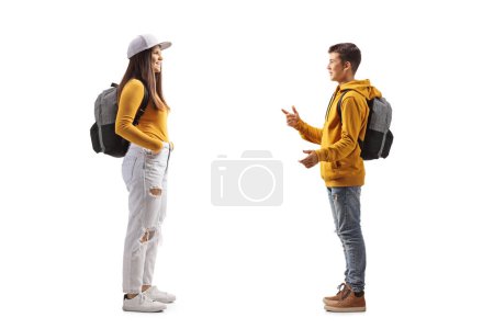 Photo for Male teenager talking to a female student isolated on white background - Royalty Free Image