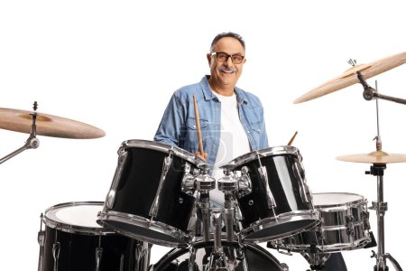 Photo for Casual mature man playing drums isolated on white backgroun - Royalty Free Image