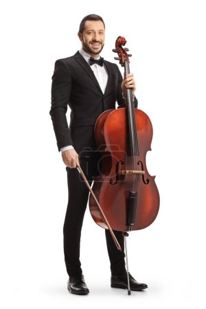 Photo for Male musician in a black suit and bow-tie posing with a cello isolated on white background - Royalty Free Image